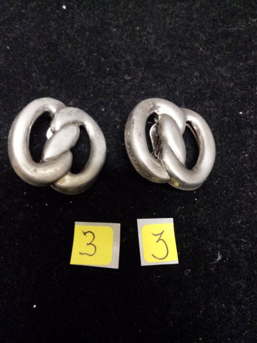 Oorbellen, zilverkleurig, krakeling vorm, type clips