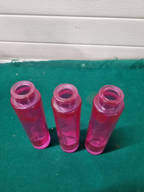 flesjes roze glas drie stuks