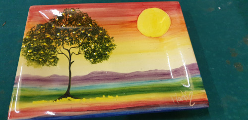 wandbord met boom en zon